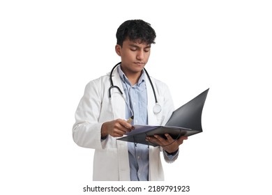 Young Peruvian Male Doctor Reading A Medical Report On A Folder. Isolated Over White Background.