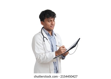 Young Peruvian Male Doctor Writing A Medical Report On A Folder. Isolated Over White Background.