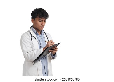 Young Peruvian Male Doctor Writing A Medical Report On A Folder. Isolated Over White Background.