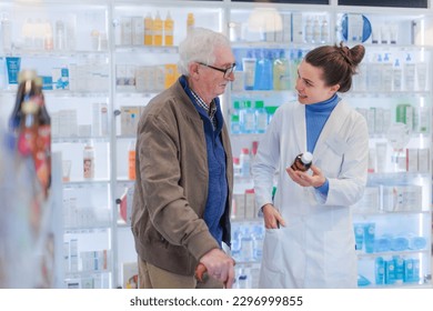 Young pharmacist helping senior man to choos medication. - Powered by Shutterstock