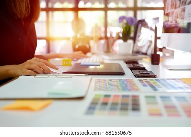 Young photographer and graphic designer at work in office. - Shutterstock ID 681550675