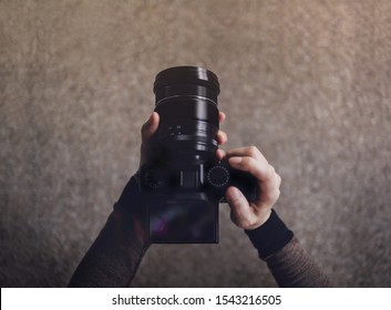 Young Photographer Woman Using Camera To Take Photo. Dark Tone, POV Or Top View In Low Angle. Selective Focus On LCD Screen