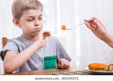 Young Picky Child Refusing To Eat Dinner