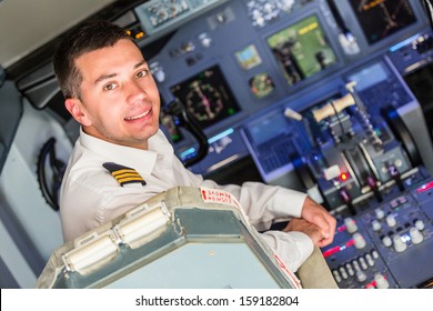 Young Pilot In The Airplane Cockpit