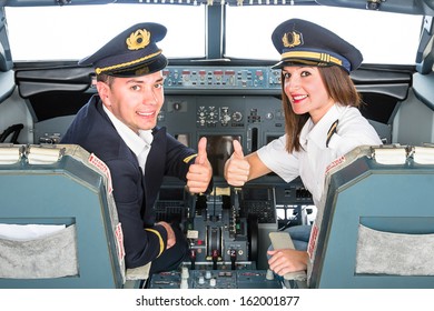 Young pilots learning in flight simulator with white copyspace in the window screen