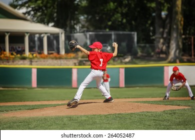 Young Pitcher On The Mound In A Youth Baseball Game