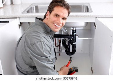 Young Plumber Fixing A Sink