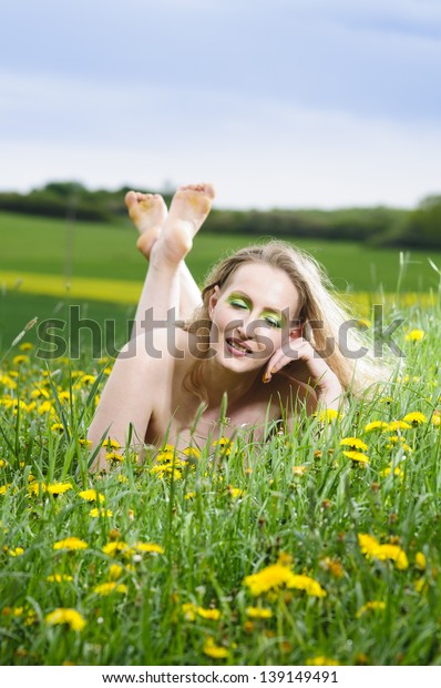 Young beautiful blonde naked plus size model with dummy 