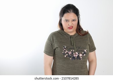 Young Plus Size South East Asian Woman Pose Face Expression Emotion On White Background Bad Disgusting