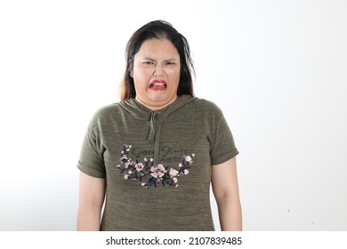 Young Plus Size South East Asian Woman Pose Face Expression Emotion On White Background Disgusting