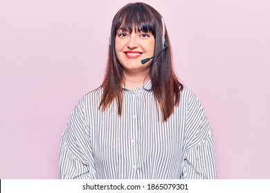 Young Plus Size Woman Wearing Call Center Agent Headset Looking Positive And Happy Standing And Smiling With A Confident Smile Showing Teeth 