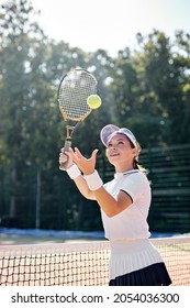 Young Positive Caucasian Tennis Player On Hardcourt During Game At Summer Day, Fit And Slim Adult Lady In Uniform Enjoy Sport Game,Preparing For Competition. Professional Athlete Portrait