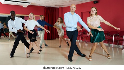 Young positive people dancing tap dance in pairs in studio

 - Powered by Shutterstock