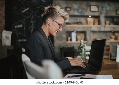 Young positive woman with glasses working in modern office. - Shutterstock ID 1149446570