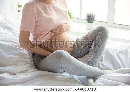 Similar – Pregnant woman embraced by her husband