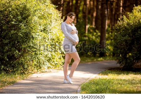 Similar – Woman in sports wear with earphones looking smartphone