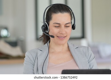 Young pregnant businesswoman at work - Shutterstock ID 1386752492