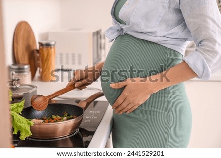 Similar – Image, Stock Photo Young pregnant woman in studio lighting