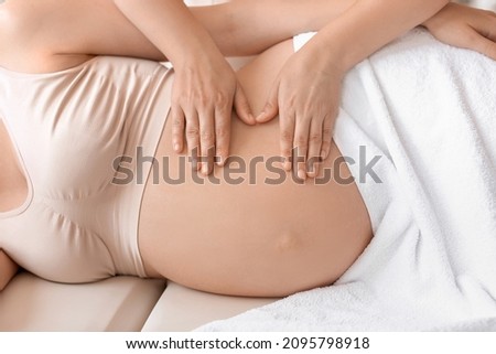 Image, Stock Photo Top view of hands massaging female abdomen