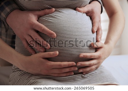 Similar – Image, Stock Photo Pregnant woman holding her tummy