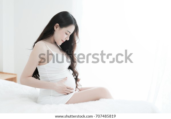 Young Pregnant Woman Relaxing While Touching Stock Photo Edit Now