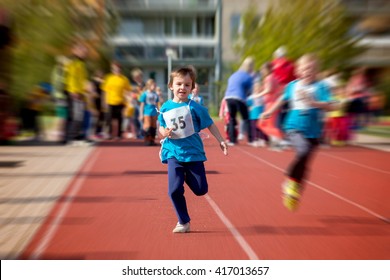 Young Preschool Children, Running On Track In A Marathon Competition, Blurred Motion