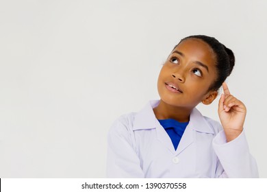 Young preteen African American kid wearing lab coat thinking and questioning in white isolated background
