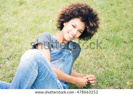 Similar – blYoung black woman, afro hairstyle, smiling outdoors