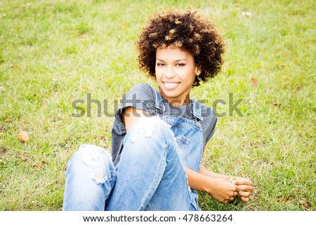 Similar – blYoung black woman, afro hairstyle, smiling outdoors