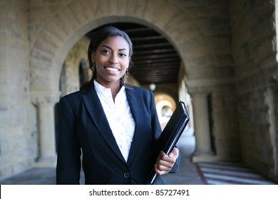 A young and pretty african american woman at college