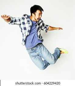 Young Pretty Asian Man Jumping Cheerful Against White Background