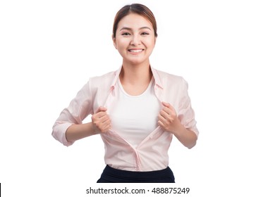 Young Pretty Asian Woman Opening Her Shirt Like A Superhero Isolated On White.