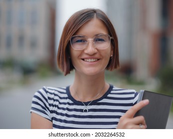 Young Pretty Asian Woman Walking With Laptop In Modern City Street On Remote IT Work, Summer Style Casual Smiling