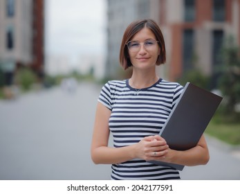 Young Pretty Asian Woman Walking With Laptop In Modern City Street On Remote IT Work, Summer Style Casual Smiling