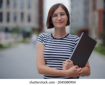 Young Pretty Asian Woman Walking With Laptop In Modern City Street On Remote IT Work, Summer Style Casual Smiling