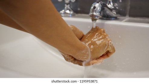 Young Pretty Black Woman Washing Her Hands