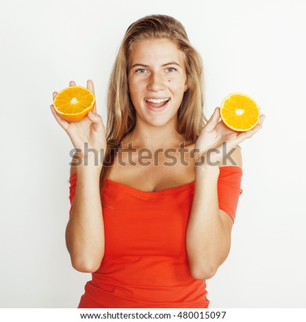 young pretty blond woman with half oranges close up isolated on white bright teenage smiling
