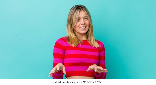 Young Pretty Blonde Woman Feeling Disgusted And Nauseous, Backing Away From Something Nasty, Smelly Or Stinky, Saying Yuck