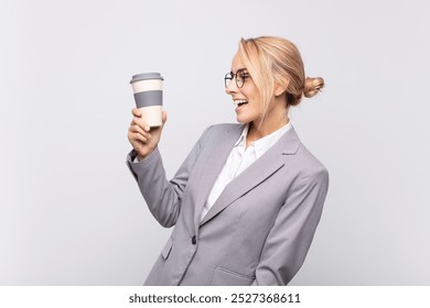 young pretty blonde woman with a take away coffee