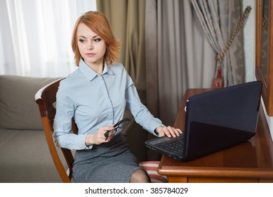 Young Pretty Business Woman With Laptop In The Hotel Room