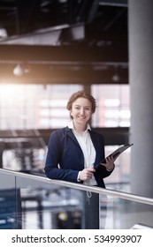 Young Pretty Business Woman At Manufacturing Enterprise