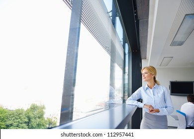 Young Pretty Business Woman With Notebook In The Bright Modern Office Indoors