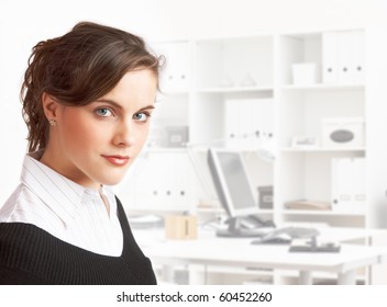 Young Pretty Dark Haired Secretary Standing In Office