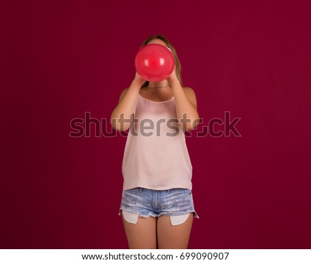 Similar – Young teenage girl blowing pink bubble gum