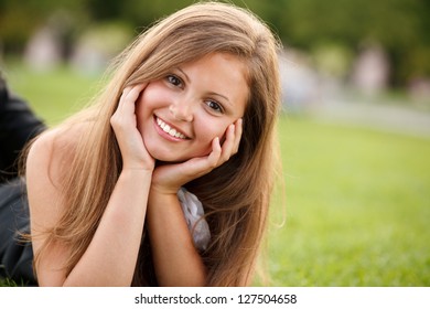 Young pretty girl smiling looking at camera