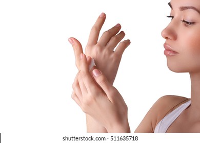 Young Pretty Girl Wearing Hand Cream On Her Perfect Smooth Hands. Face Portrait On Isolated Background