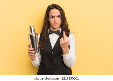 young pretty hispanic woman feeling angry, annoyed, rebellious and aggressive. bartender and cocktail concept - Shutterstock ID 2219130001