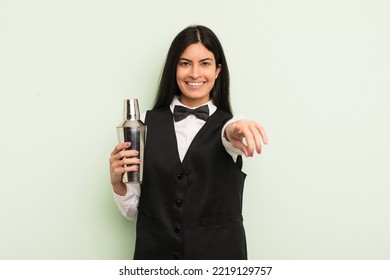 Young Pretty Hispanic Woman Pointing At Camera Choosing You. Cocktail Bartender Concept