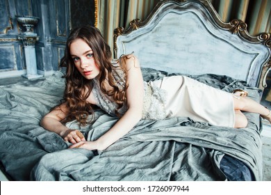 Young Pretty Lady Girl Posing Sexy In Vintage Hotel Bedroom Interior, Lifestyle Rich People Concept