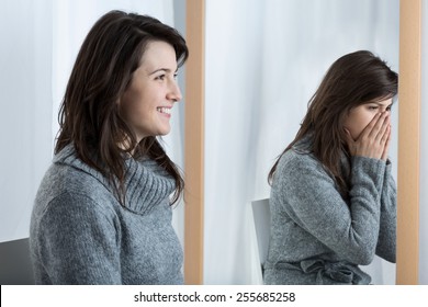 Young pretty smiling woman and her different reflection in the mirror